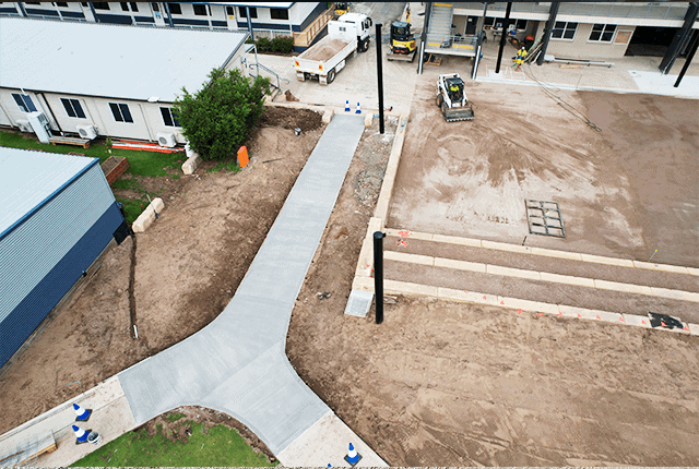 New concrete pathway and parking lot under construction by Said Civil Contractors.